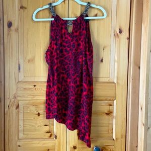 Asymmetrical red tunic with braided neckline